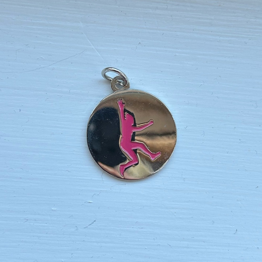 Dirty Girl silver tone pendant.
